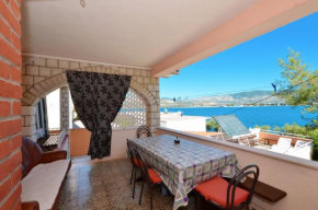 A - large apt with big terrace next to the beach